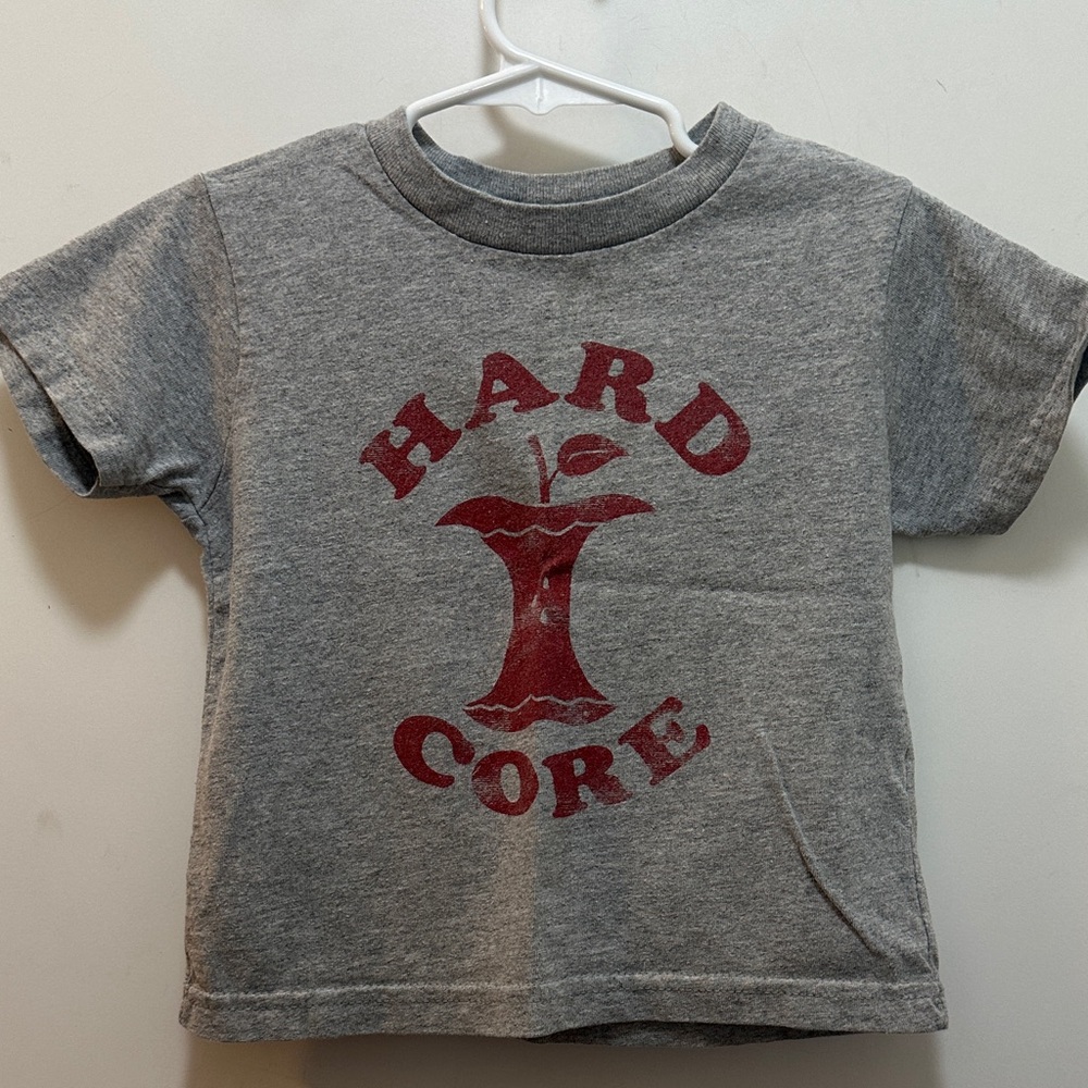 Rabbit Skins Gray Tee with Red Apple 🍎 Core Print Says, Hard Core” Size 4